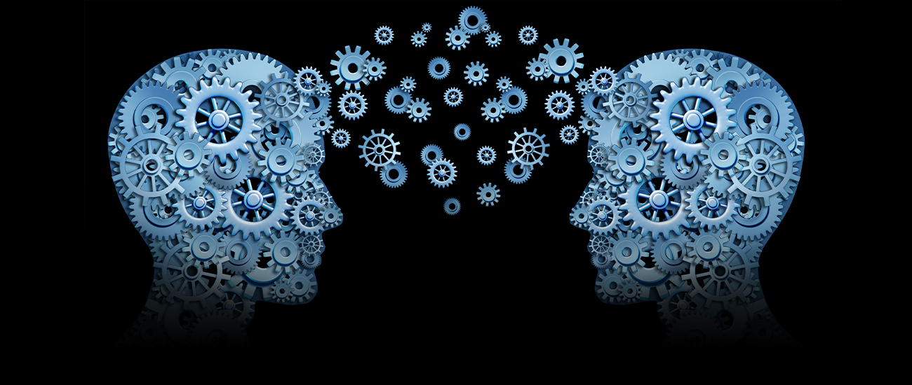 Two heads adorned with gears